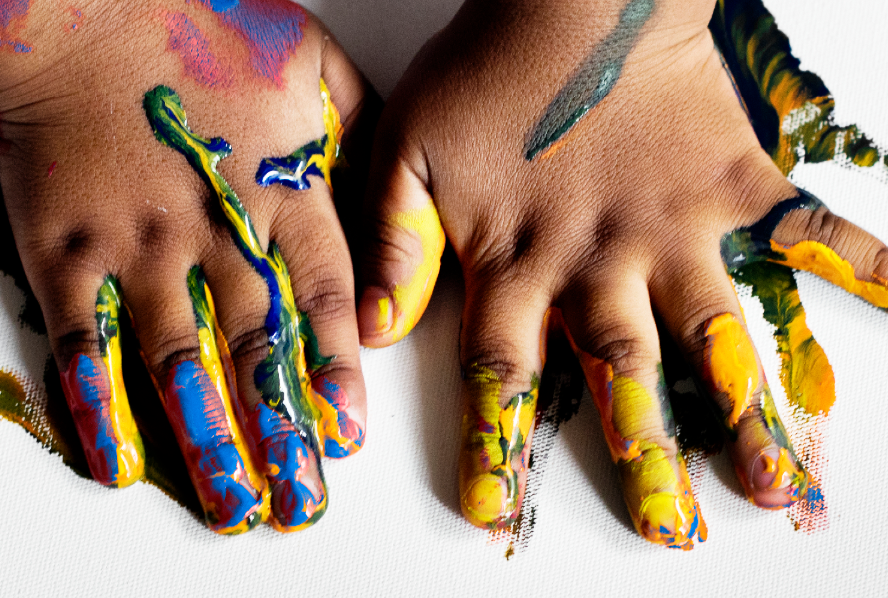 Paint-covered hands from the July 2026 program update.